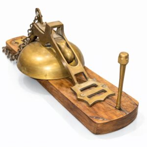 antique brass mechanical counter bell with wooden base