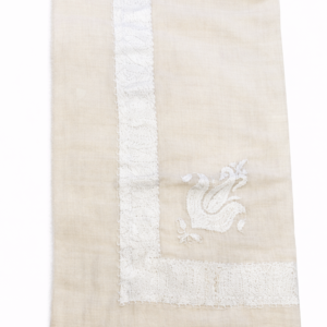 white pashmina shawl with pastel pink and purple needlework
